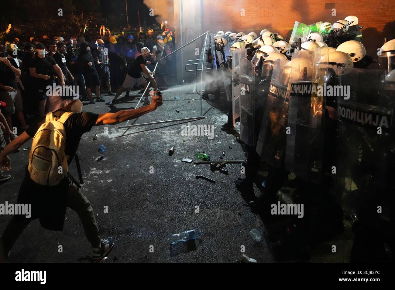 Anti-government protesters clash with riot police during a protest ...