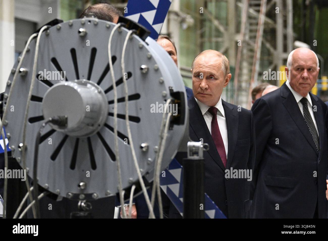Russian President Vladimir Putin, left, accompanied by Rostec ...