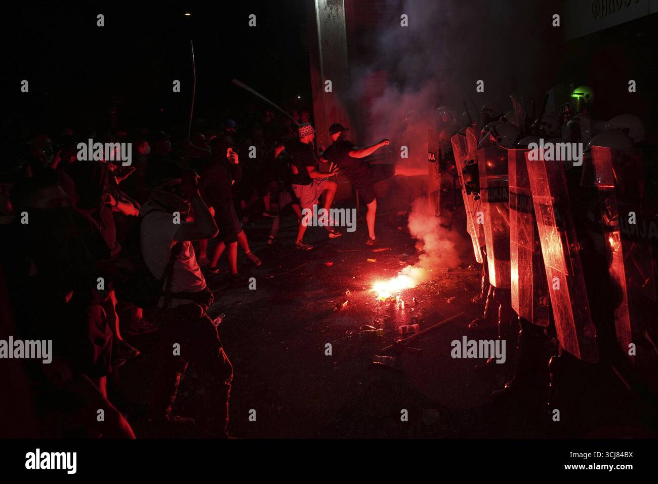 Anti-government protesters clash with the riot police during a protest ...