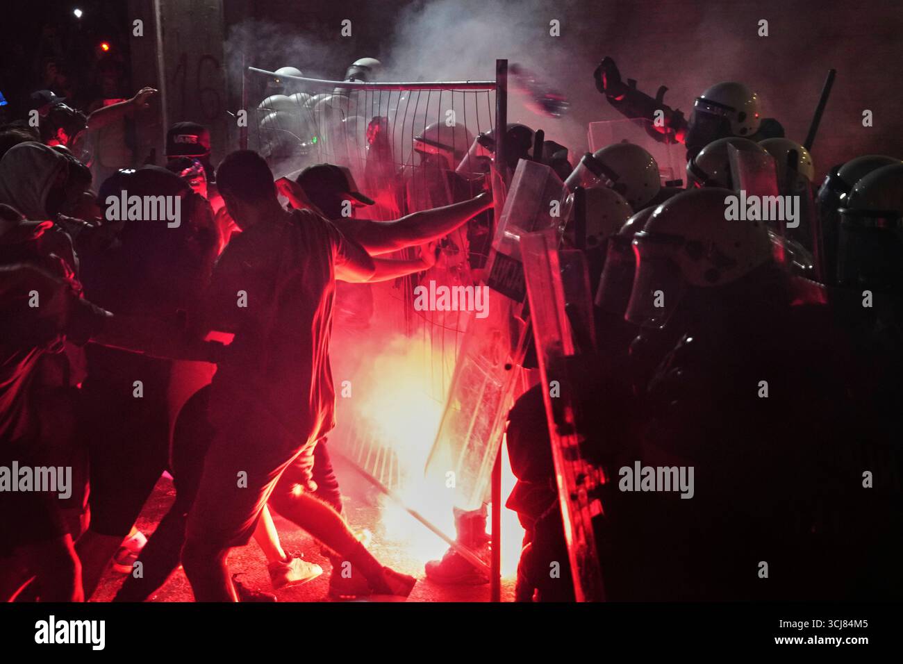 Anti-government protesters clash with riot police during a protest ...