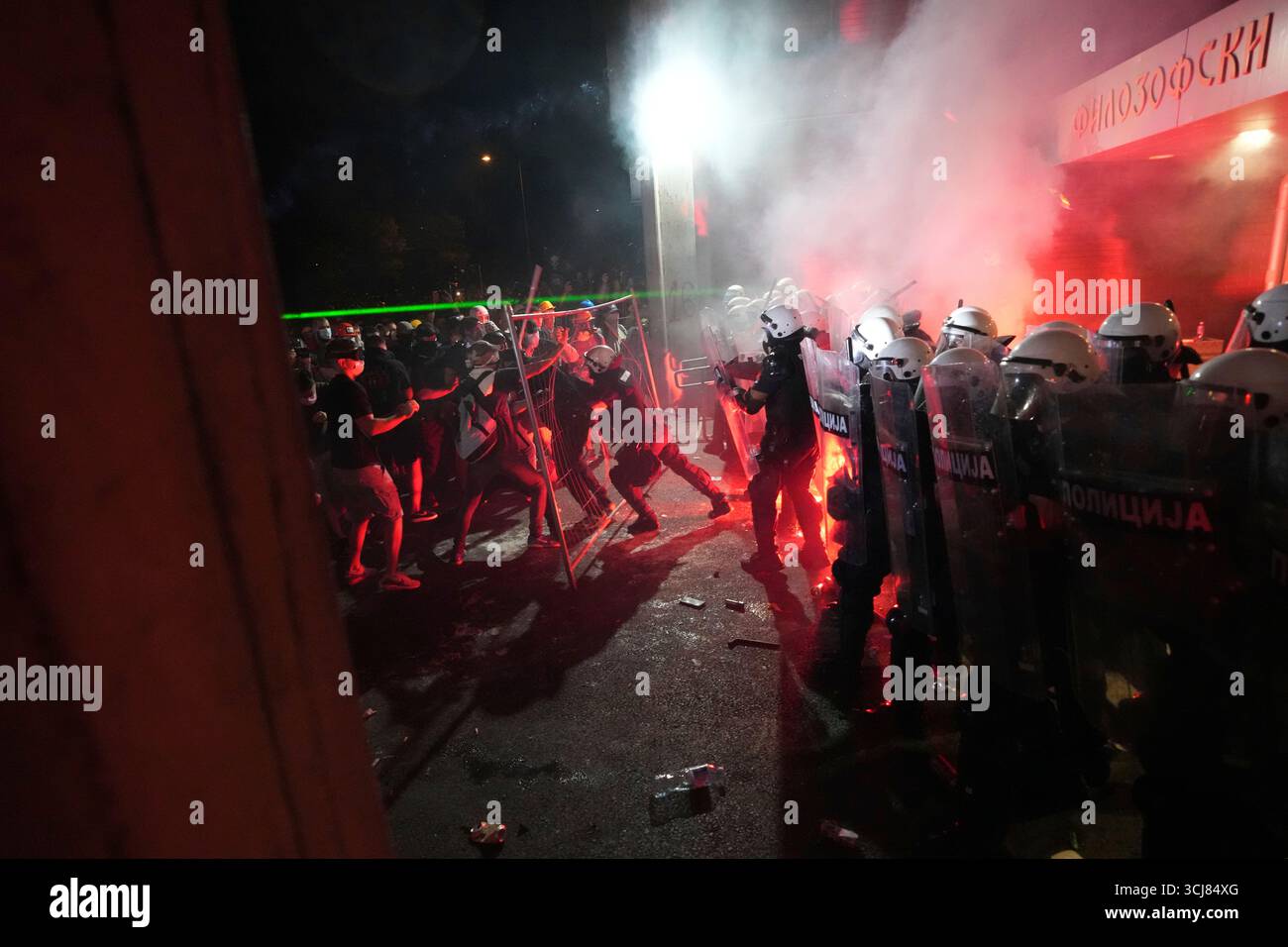 Anti-government protesters clash with riot police during a protest ...