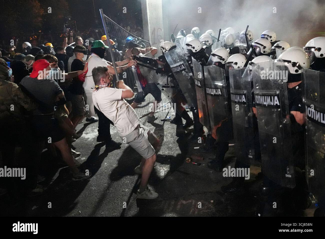 Anti-government protesters clash with riot police during a protest ...