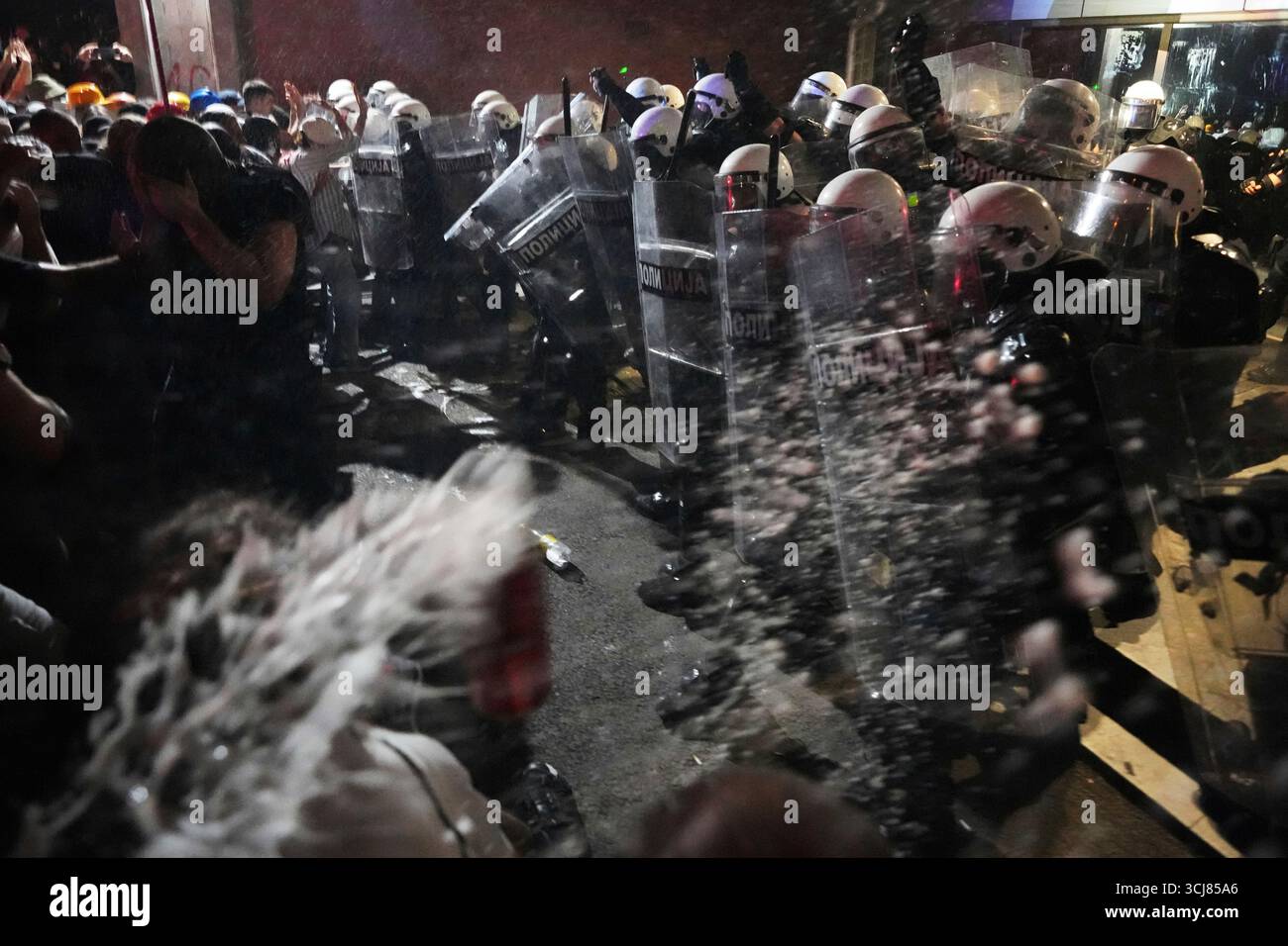 Anti-government protesters clash with riot police during a protest ...