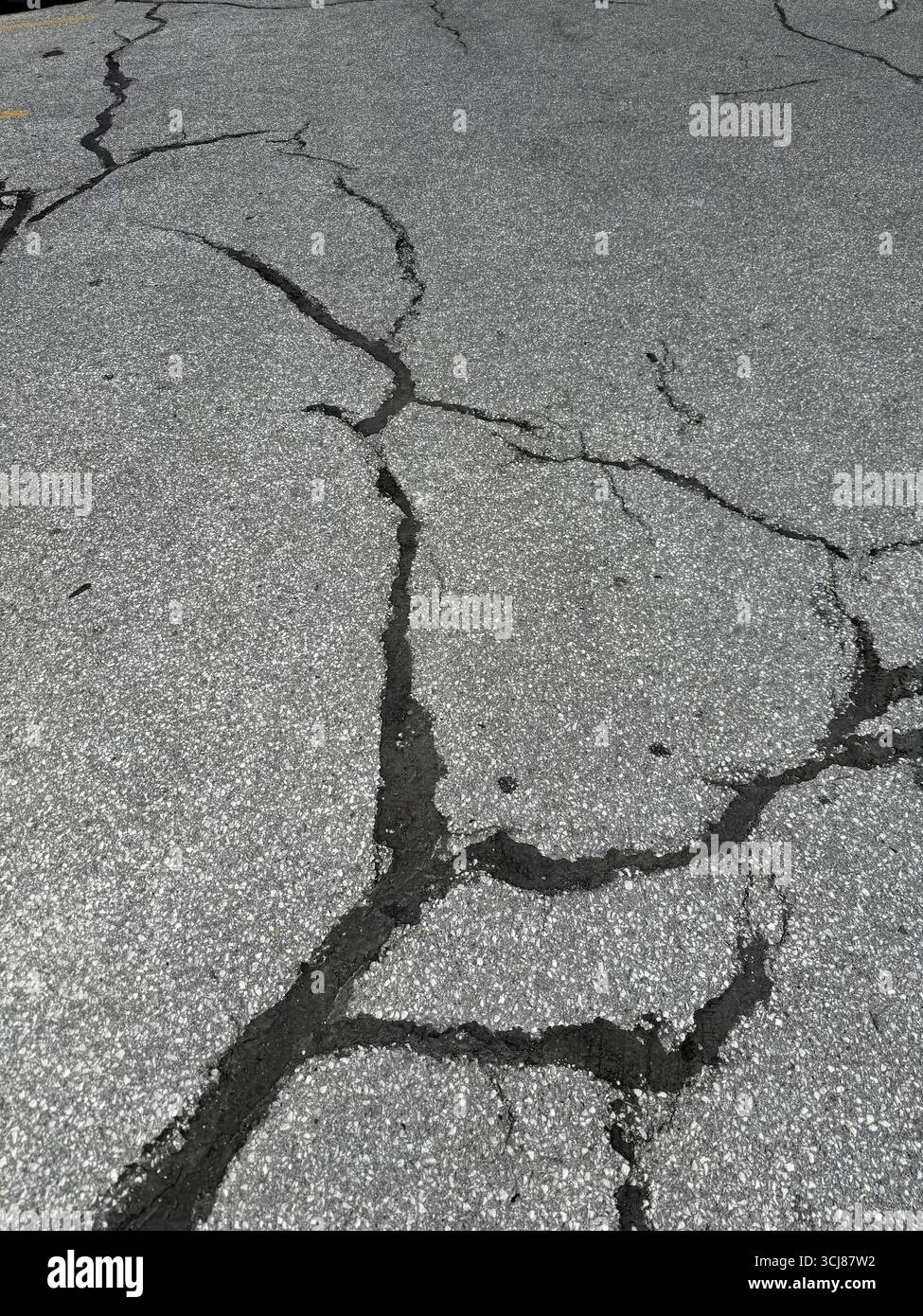 Patchwork on old asphalt parking lot. Stock Photo