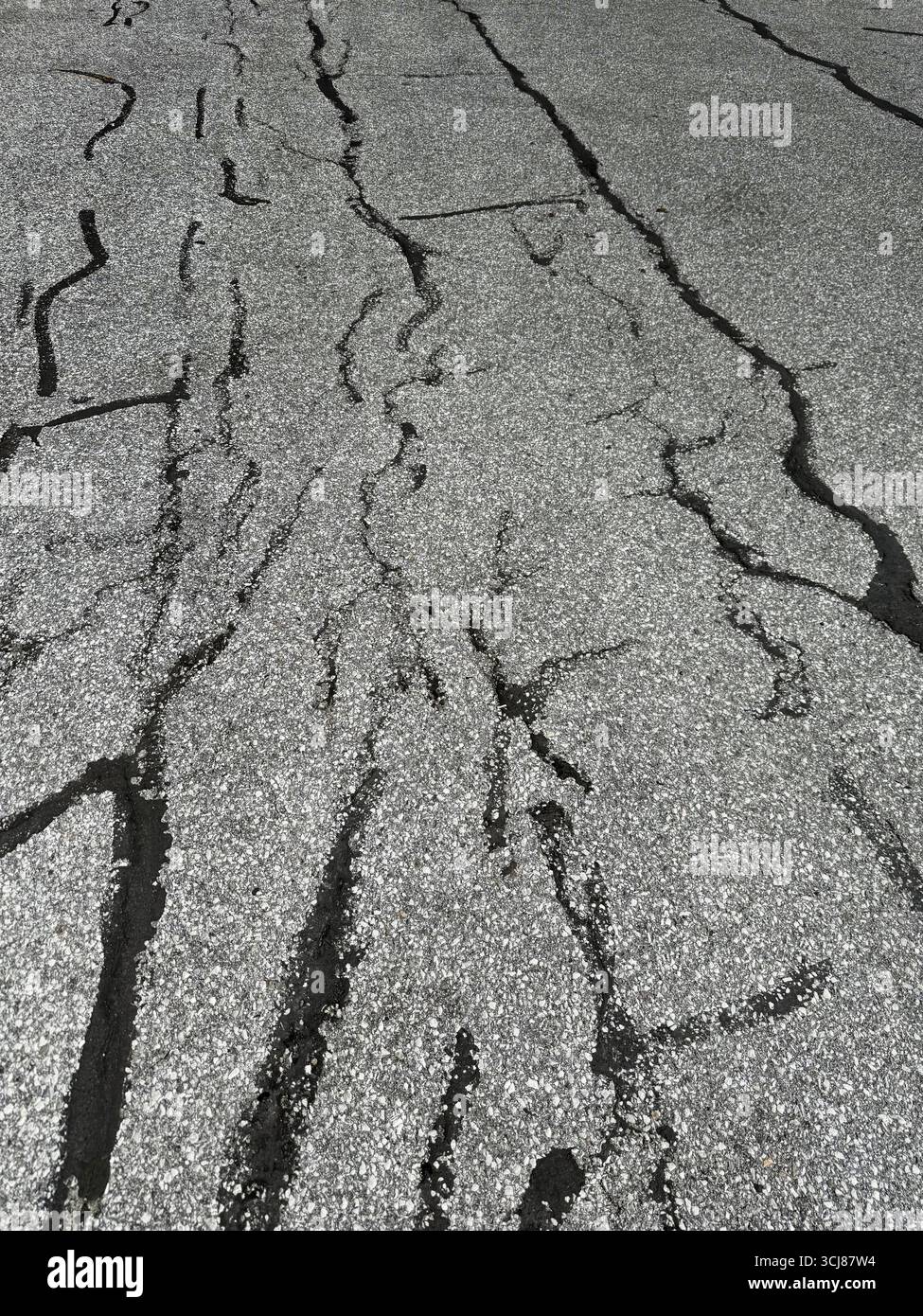 Patchwork on old asphalt parking lot. Stock Photo