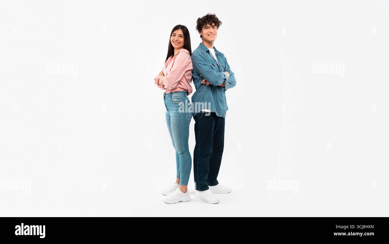 Happy Young Couple Posing Standing Over White Background Stock Photo