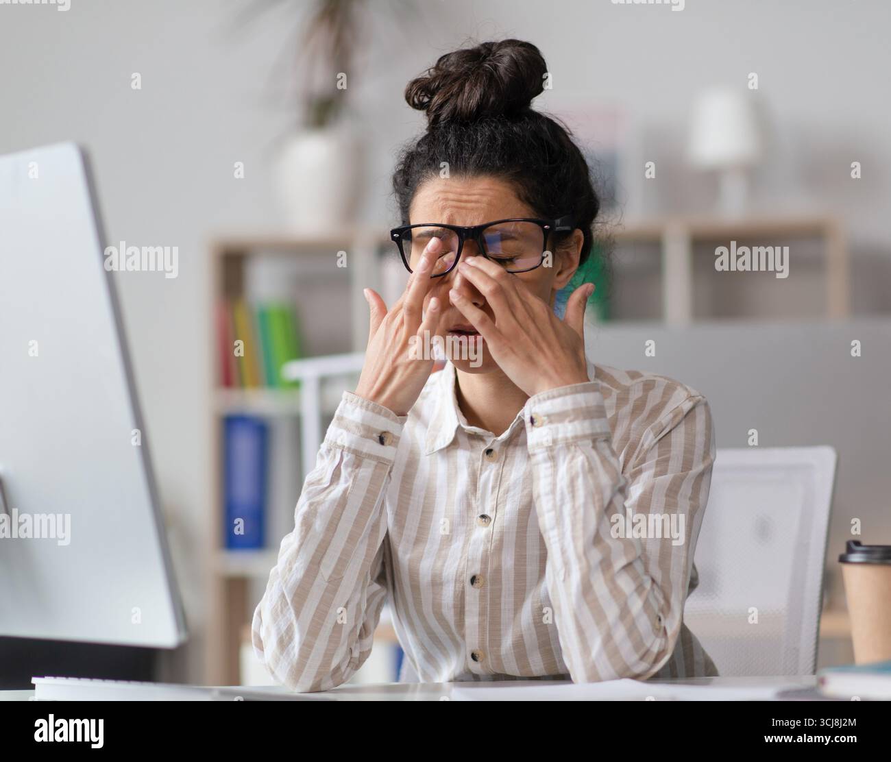Female office worker rubbing hi-res stock photography and images - Alamy