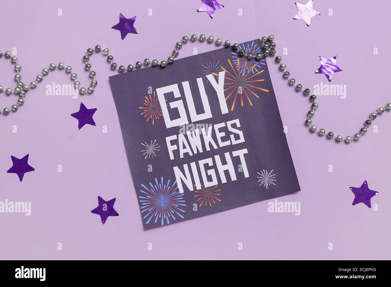 Greeting card for Guy Fawkes night with beads and confetti on purple ...
