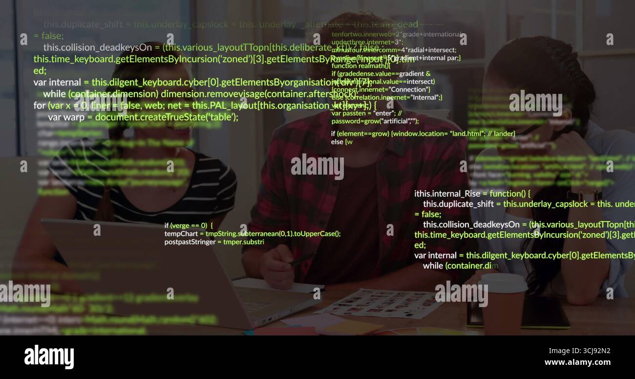 Reviewing software developers collaborating on code in meeting room, with laptop and code sheets Stock Photo