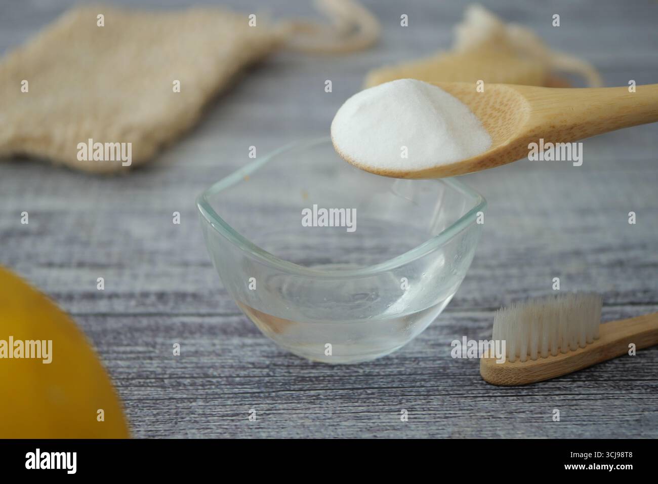 mixing baking soda powder with water for cleaning  Stock Photo
