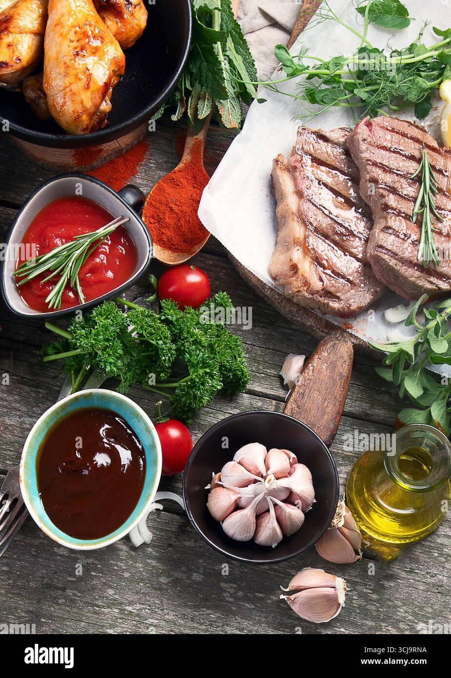 Grilled meat  on rustic wooden table. Top view Stock Photo