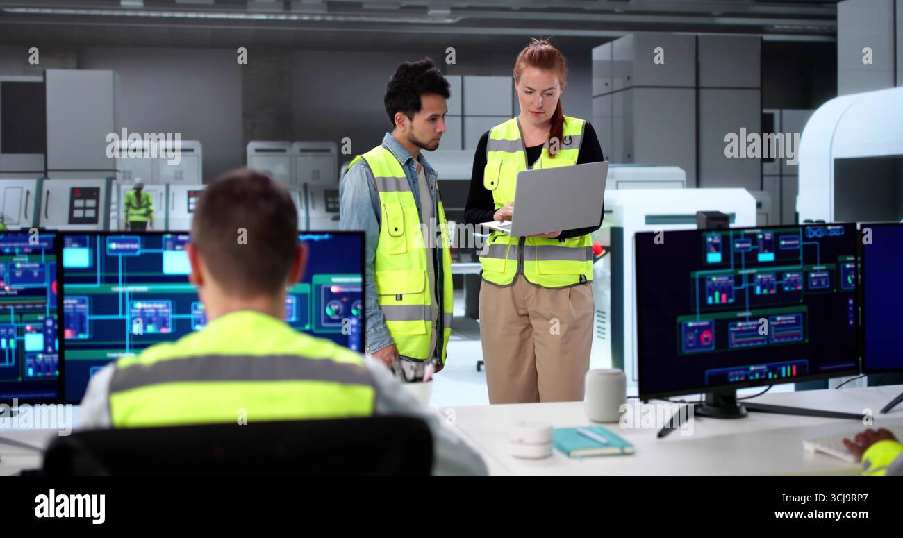 Modern SCADA Software In Industrial Plant Control - Diverse Team Learning Stock Photo