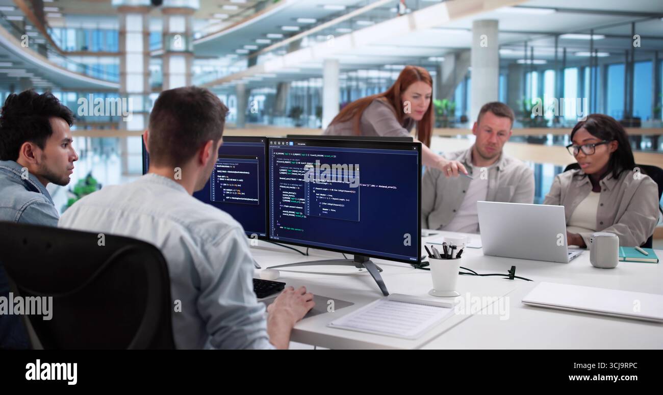 Multiracial Coding Team Developing Software In Modern Business Office Setting Stock Photo