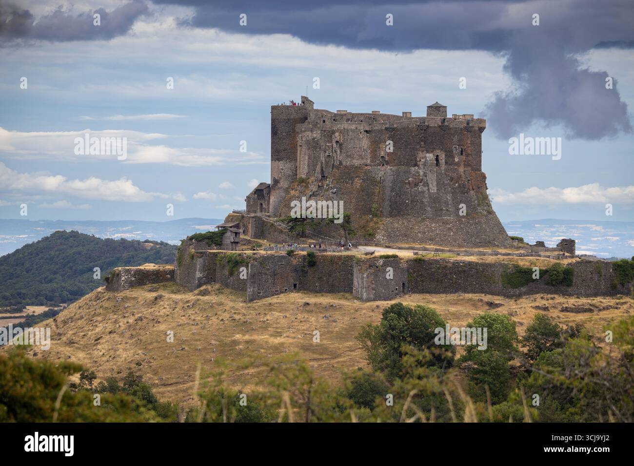 MUROL, FRANCE, 23 JULY 2025: Summer view of the medieval castle of Chateau de Murol in Puy de Dome, France. It is a popular tourist attraction in the - Stock Image