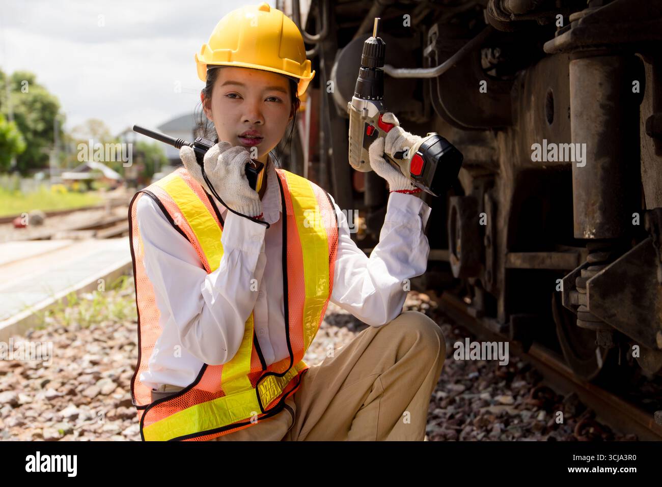 Asian young teen engineer worker work in Train station, Old locomotive ...