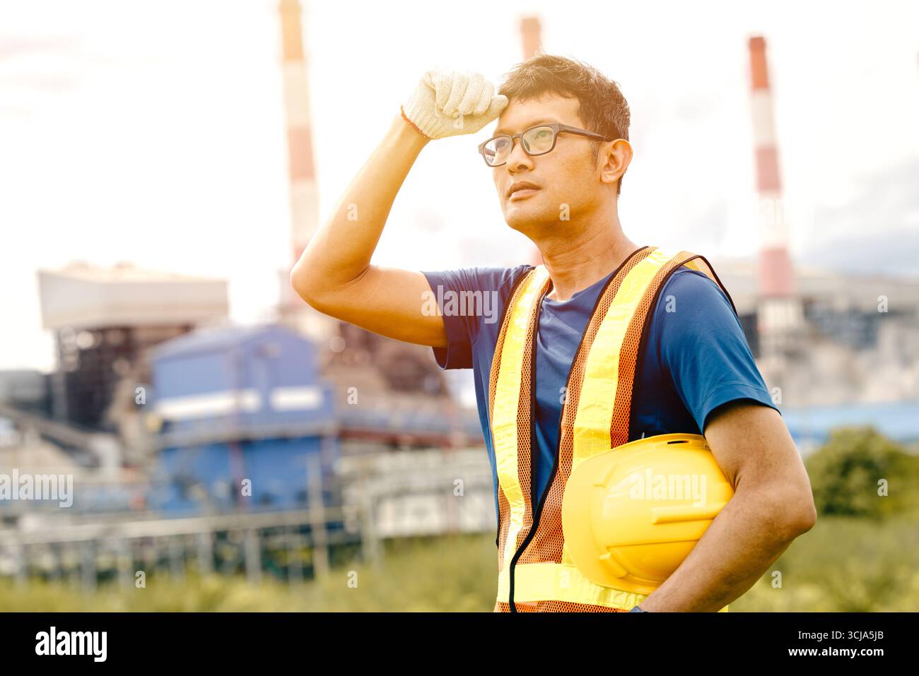 Tired worker, Hard working outdoor, Engineer male exhausted sweating work in UV heat environment Stock Photo