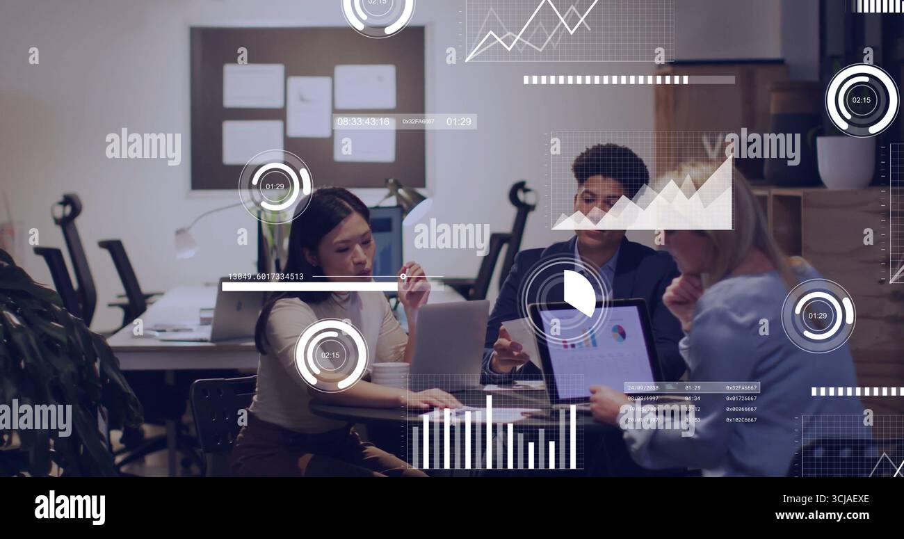 Collaborating three professionals analyzing charts on laptops and tablet at office meeting, board Stock Photo