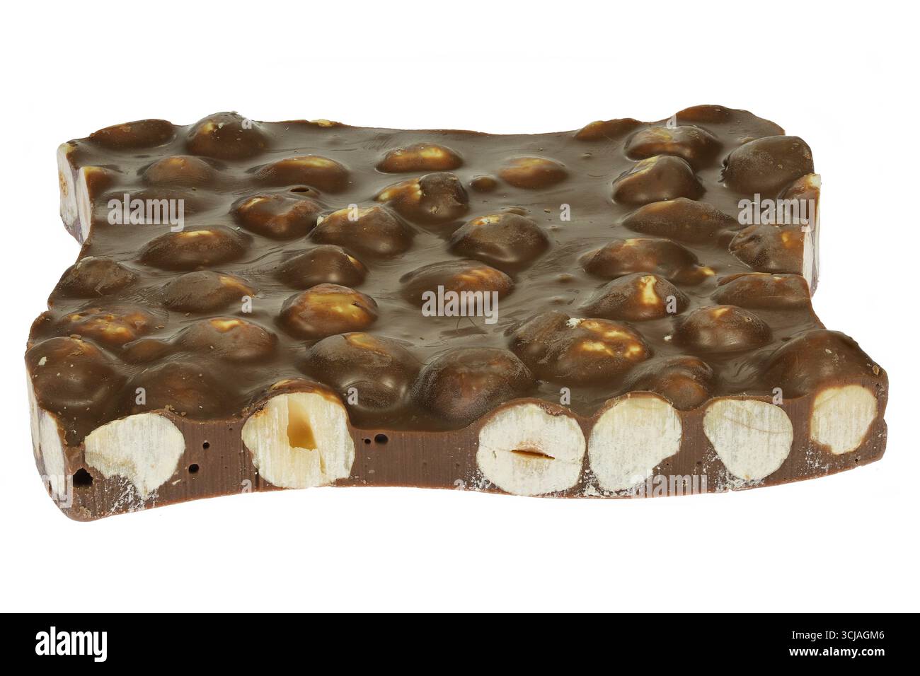 handmade broken chocolate with hazelnuts isolated on white background Stock Photo