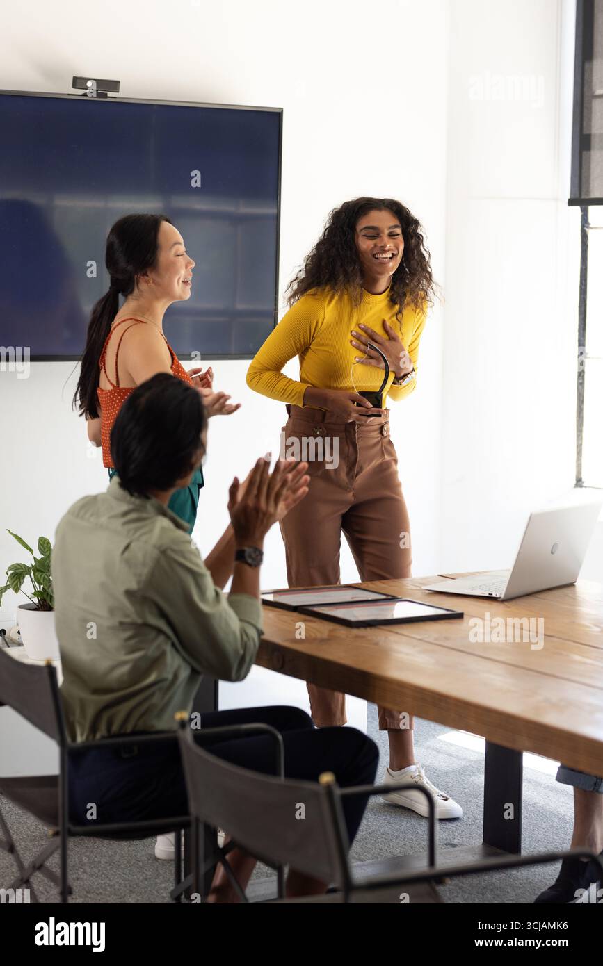 Collaborating in modern office, diverse business team presenting ideas ...