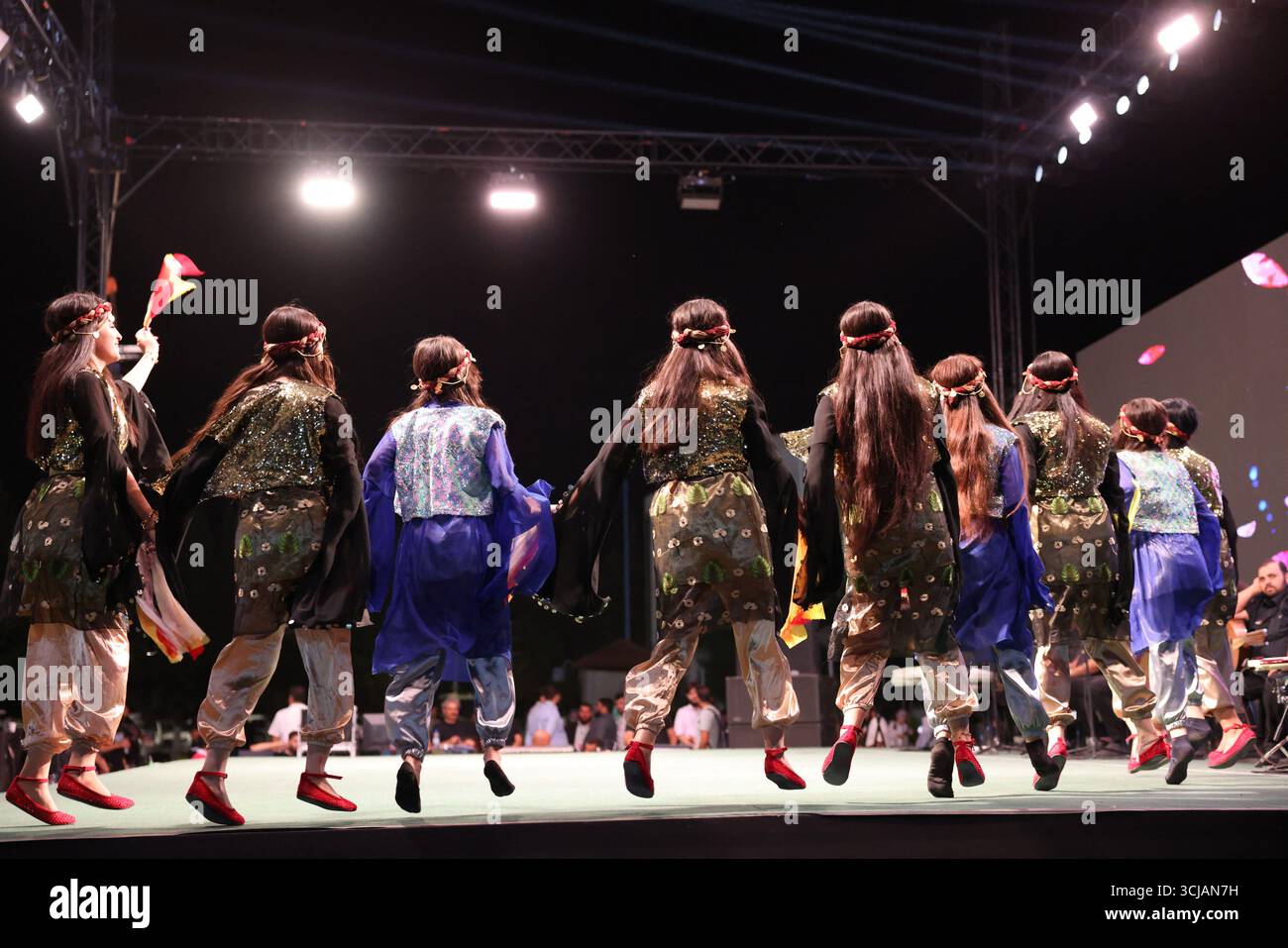 A Kurdish traditional dance troupe performs during the Damascus ...