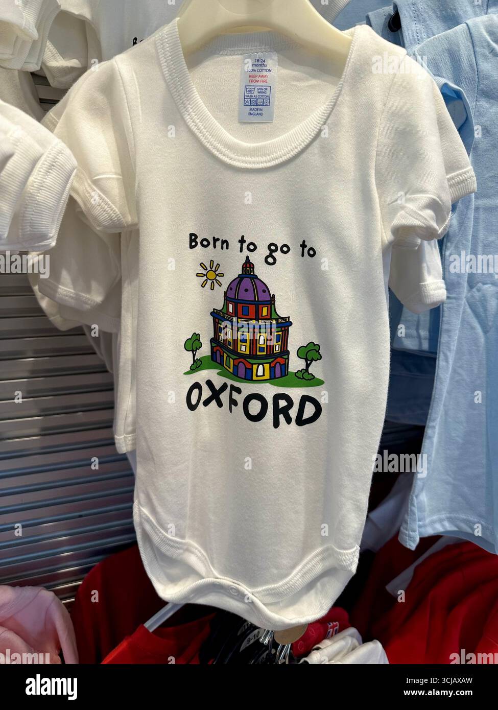 A baby onesie that says Born to go to OXFORD - Smartphone Captured Stock Image