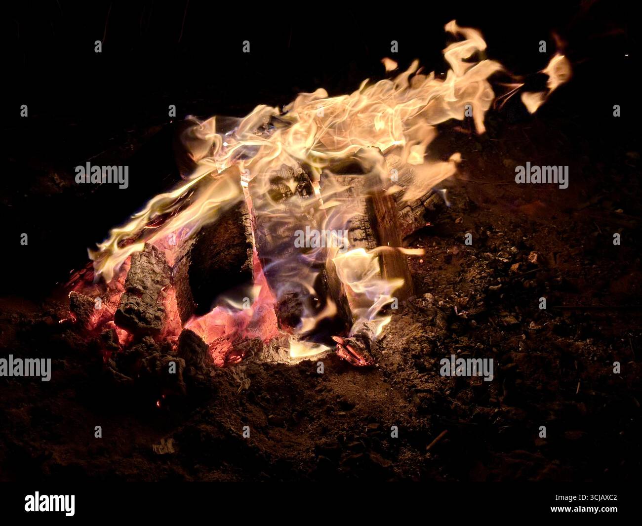 A campfire at night - Smartphone Captured Stock Image