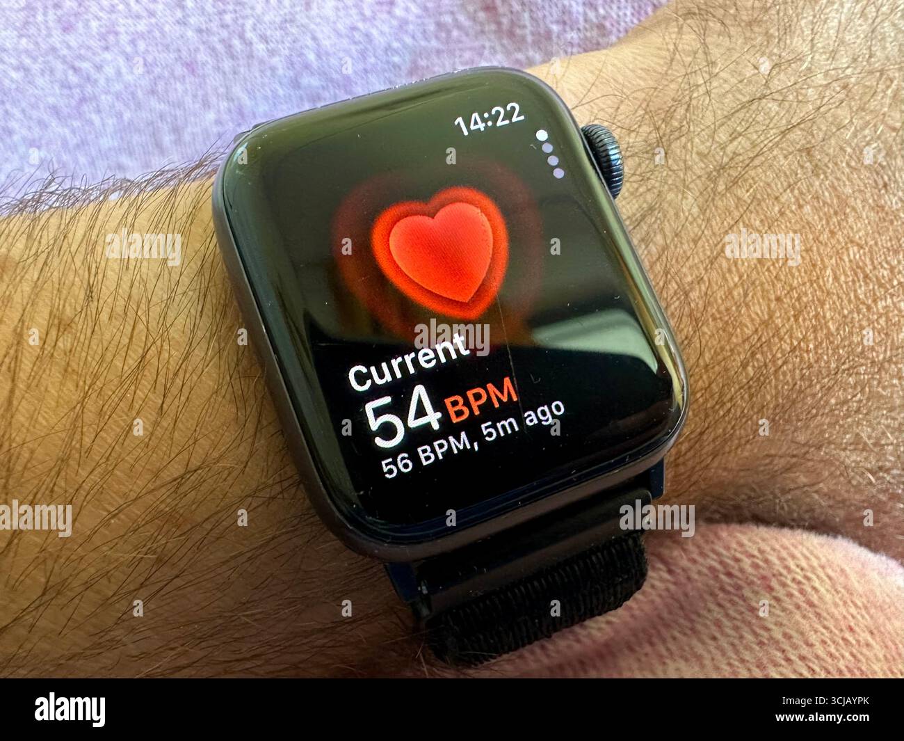 Apple watch SE with the current heart beats per minute showing Stock Photo