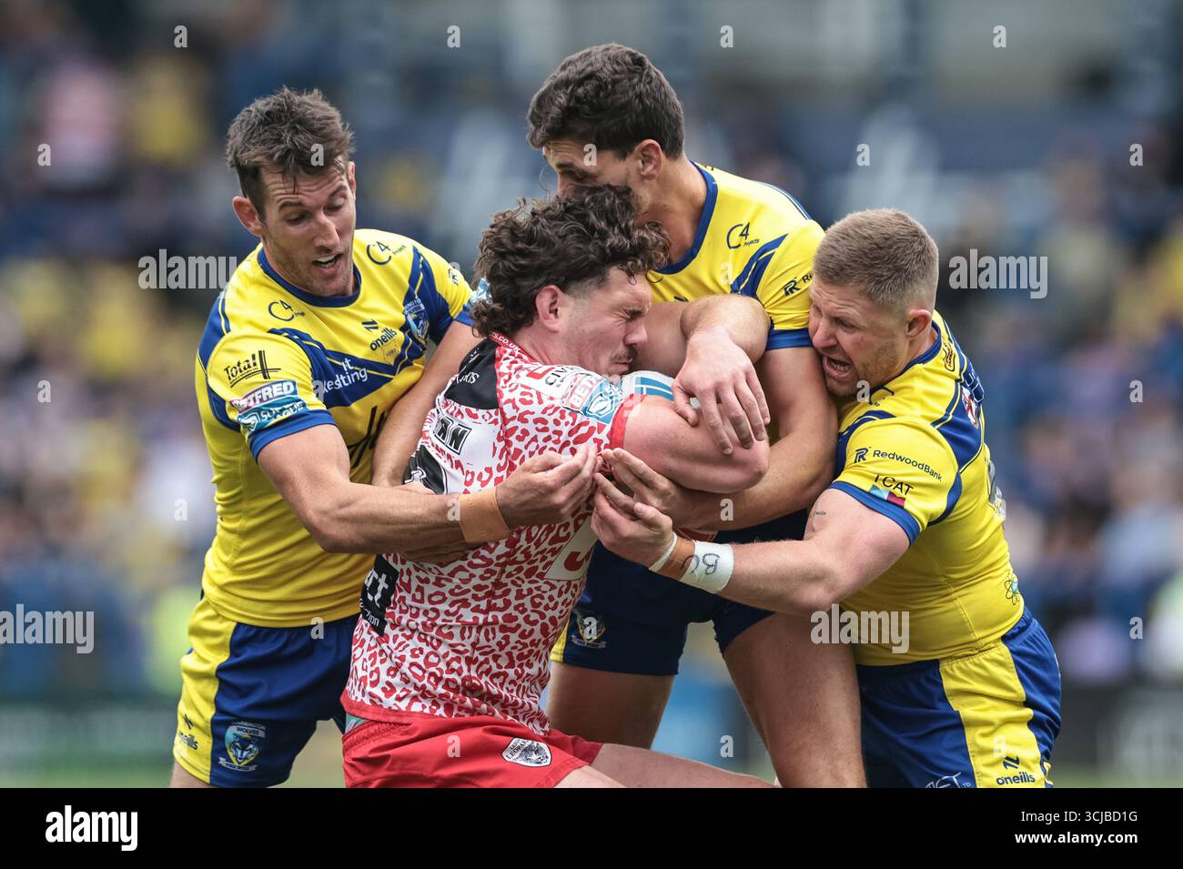 Robbie Mulhern of Leigh Leopards is tackled by Stefan Ratchford, Ryan ...