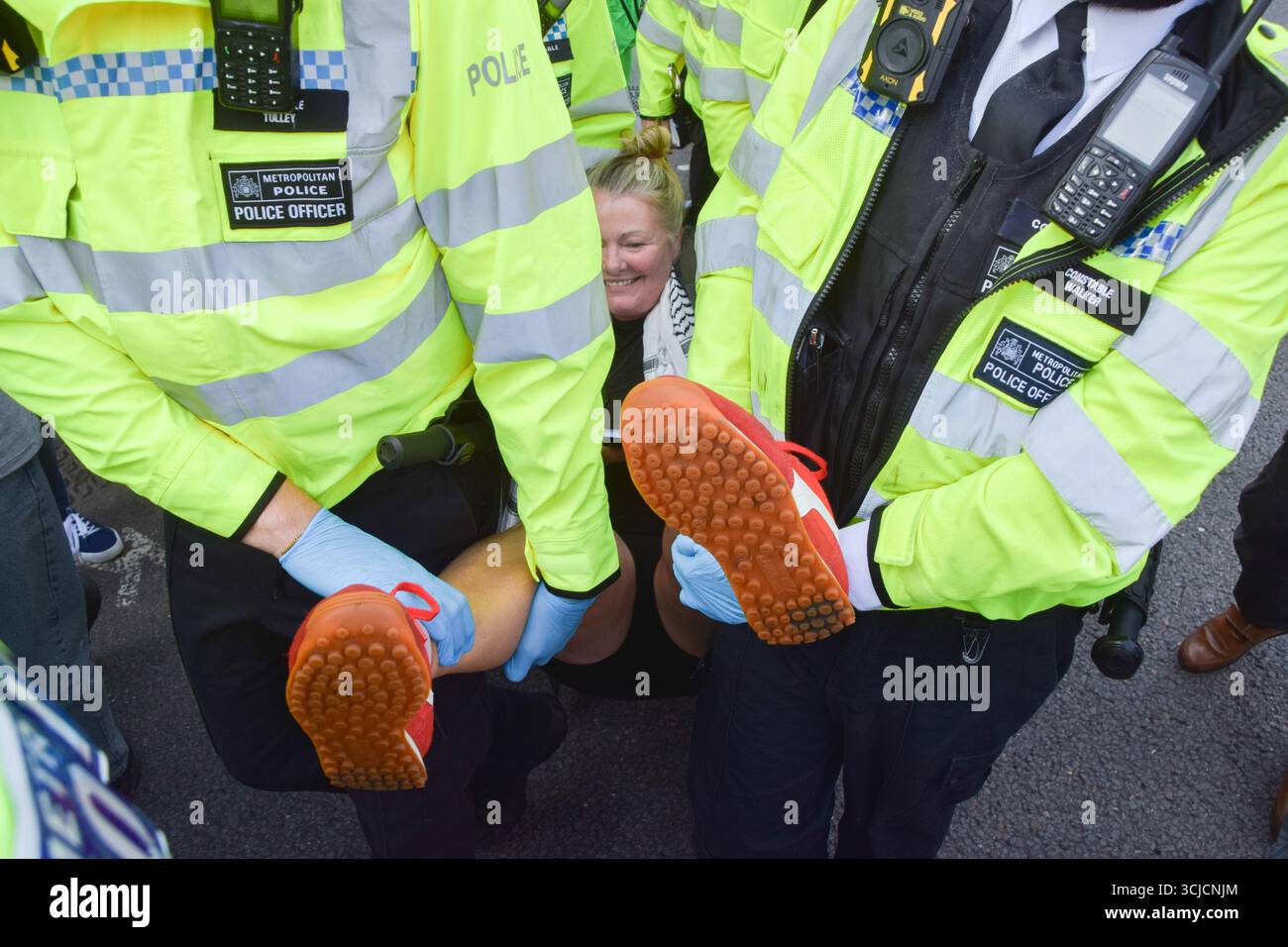 Female police officer arresting woman hi-res stock photography and ...