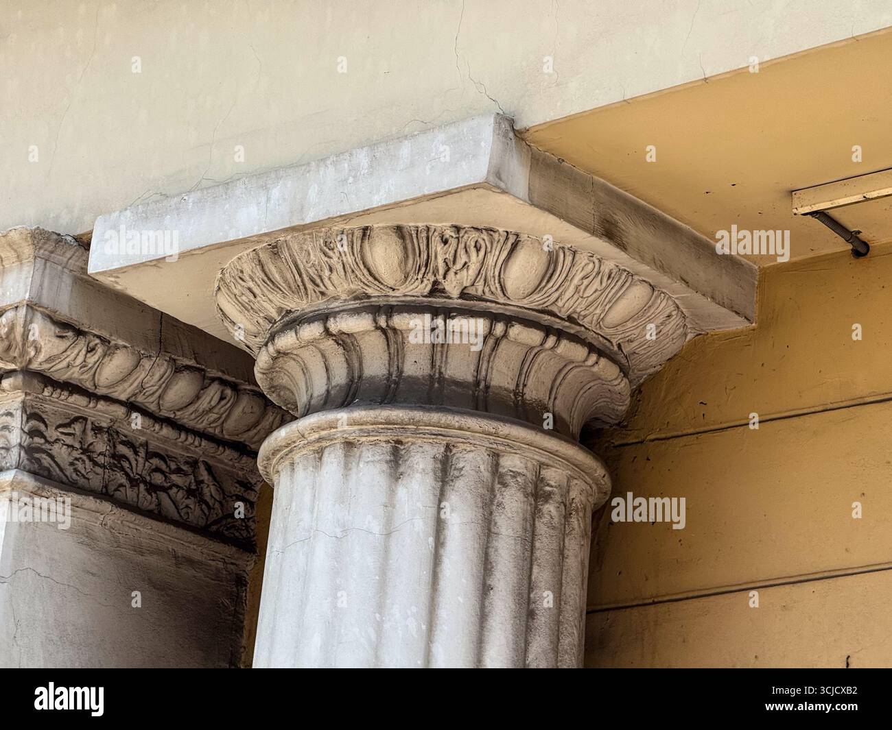 Detailed stone capital of a classical column with decorative carving ...