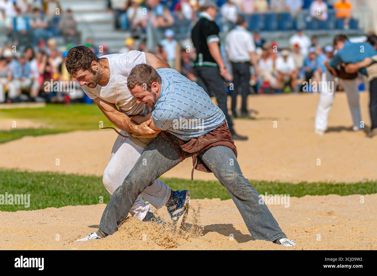 Swiss wrestlers fighting at the NOS 2012 in Silvaplana, Switzerland Stock Photo