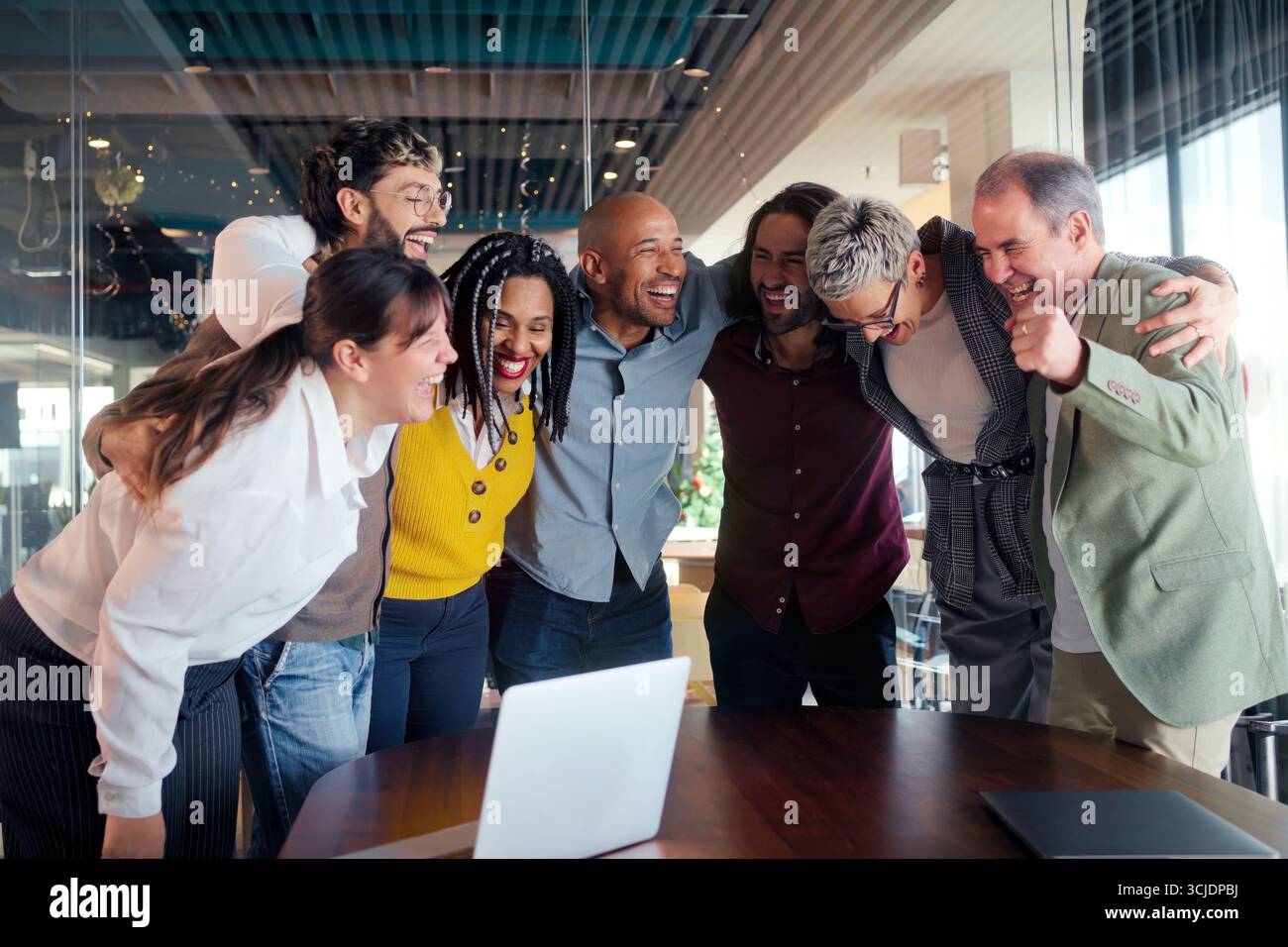 Diverse team huddle in modern office Stock Photo
