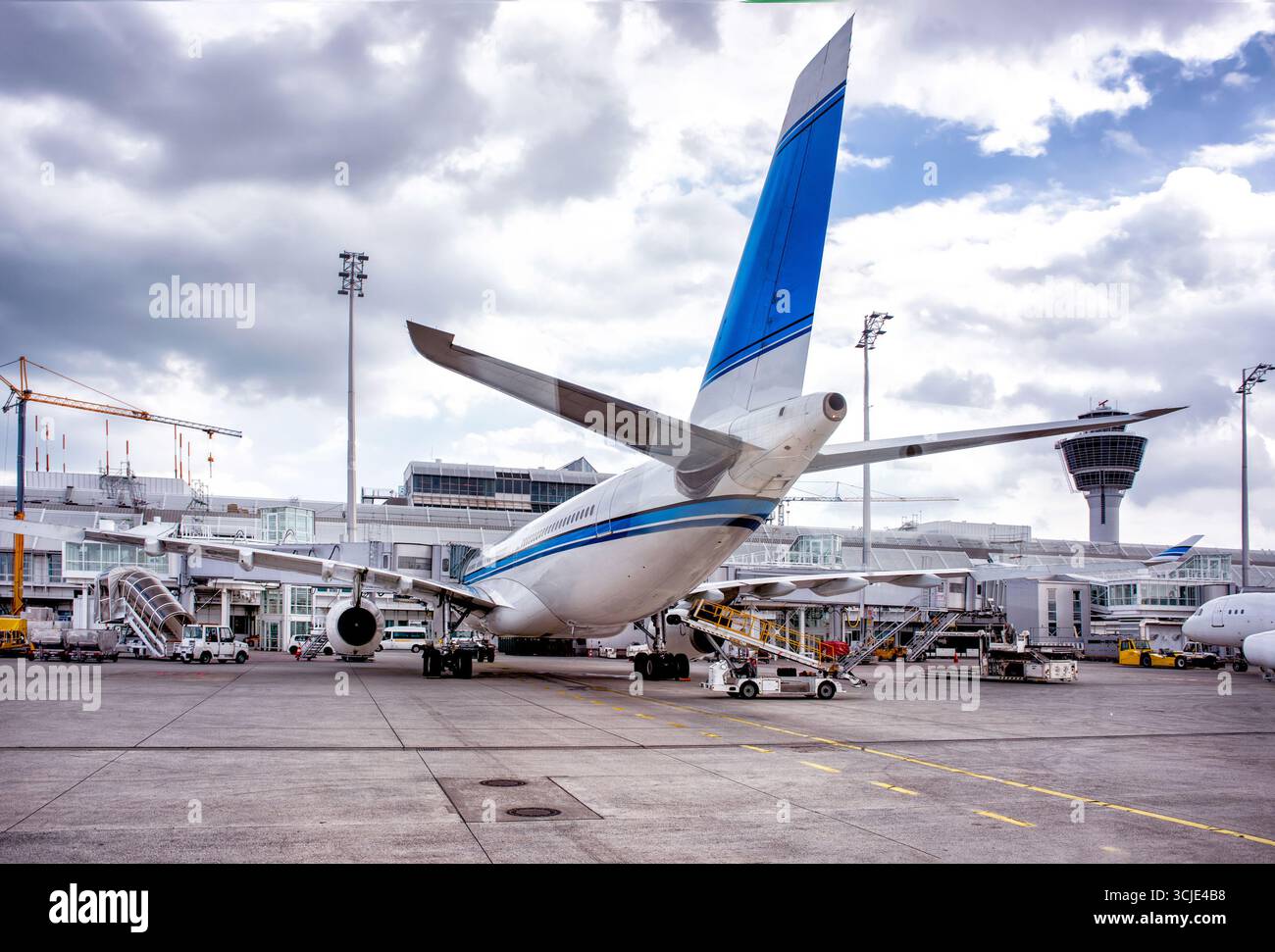 Loading of big aeroplane at airport. Stock Photo