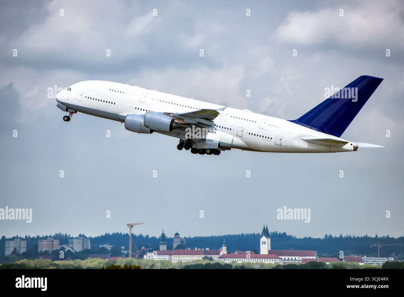 Big aeroplane is taking-off over city. Stock Photo
