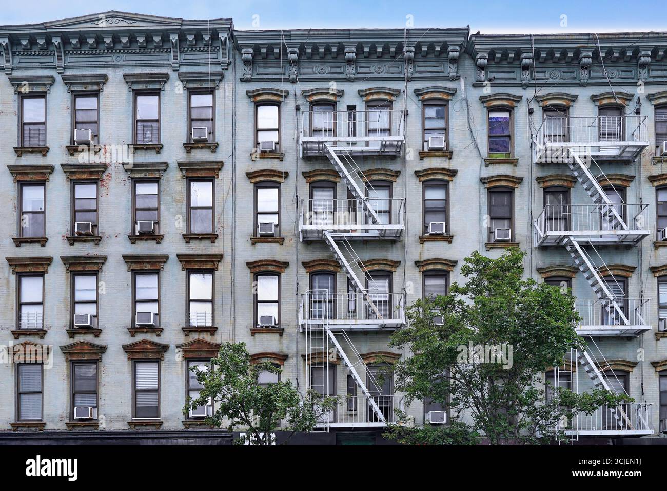 Old New York apartment building with external fire escape and rusty ...
