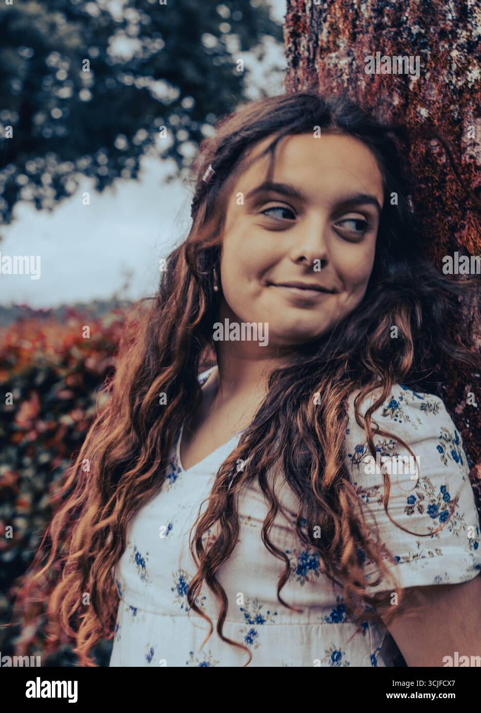 Portrait of Young Woman among Autumn Leaves Stock Photo