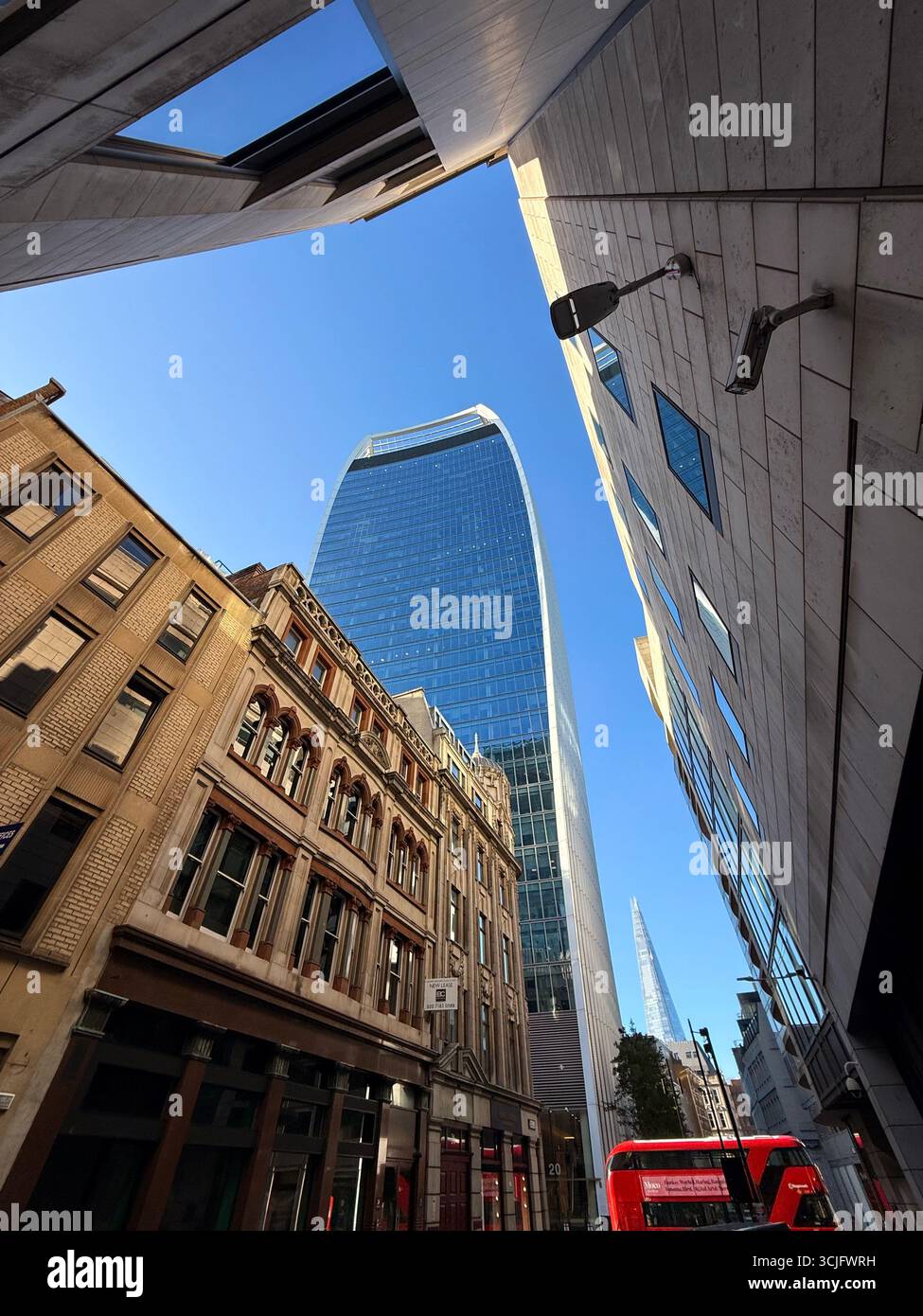 The Shard and Walkie Talkie (Sky Garden) building from Fenchurch street with red London bus - Smartphone Captured Stock Image The Shard and Walkie Talkie (Sky Garden) building from Fenchurch street with red London bus - Smartphone Captured Stock Image