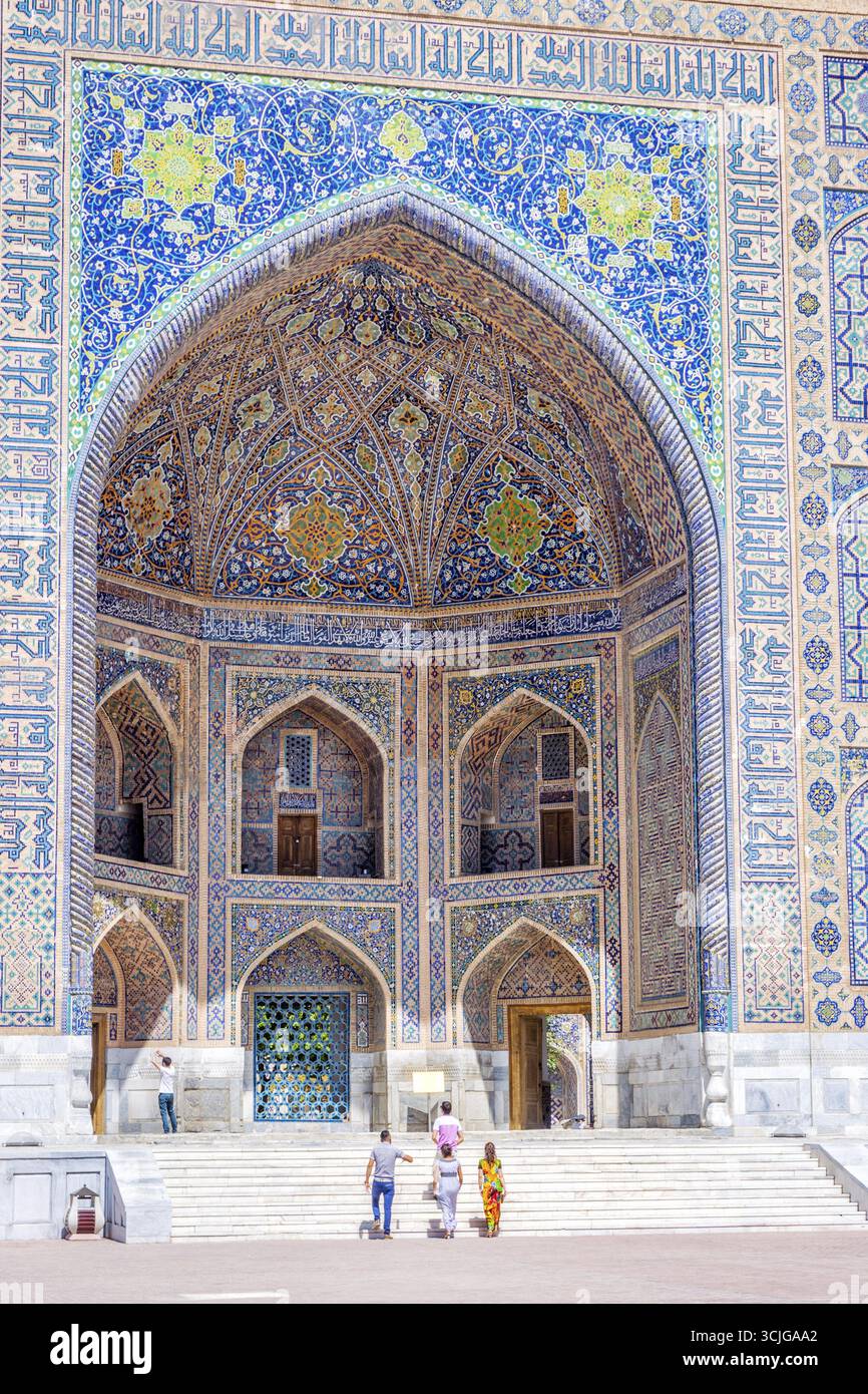 SAMARKAND, UZBEKISTAN - AUGUST 8: People passing in front of Sher-Dor ...