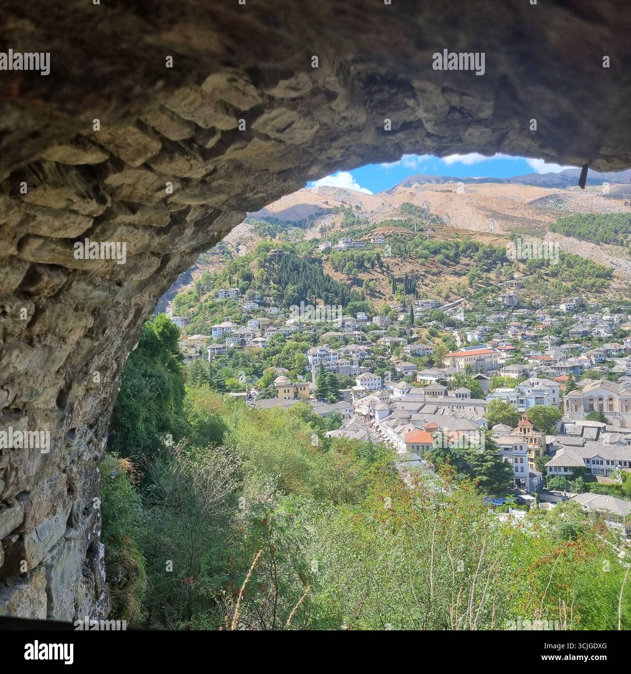 Views of Gjirokaster Town through an Archway in Gjirokaster Castle in Gjirokaster Albania - Smartphone Captured Stock Image