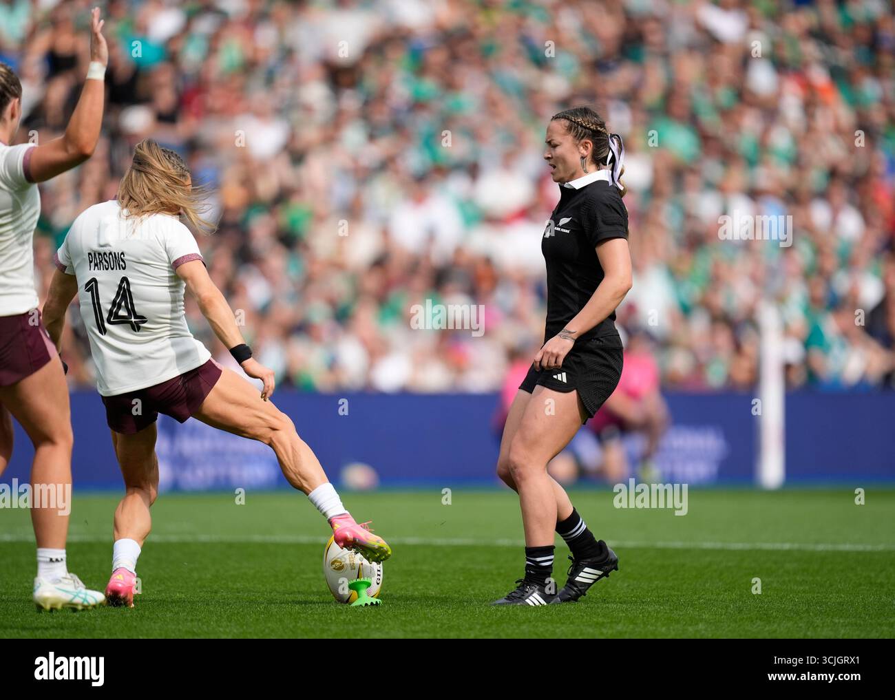Ireland's Beibhinn Parsons (left) charges down a conversion attempt by ...