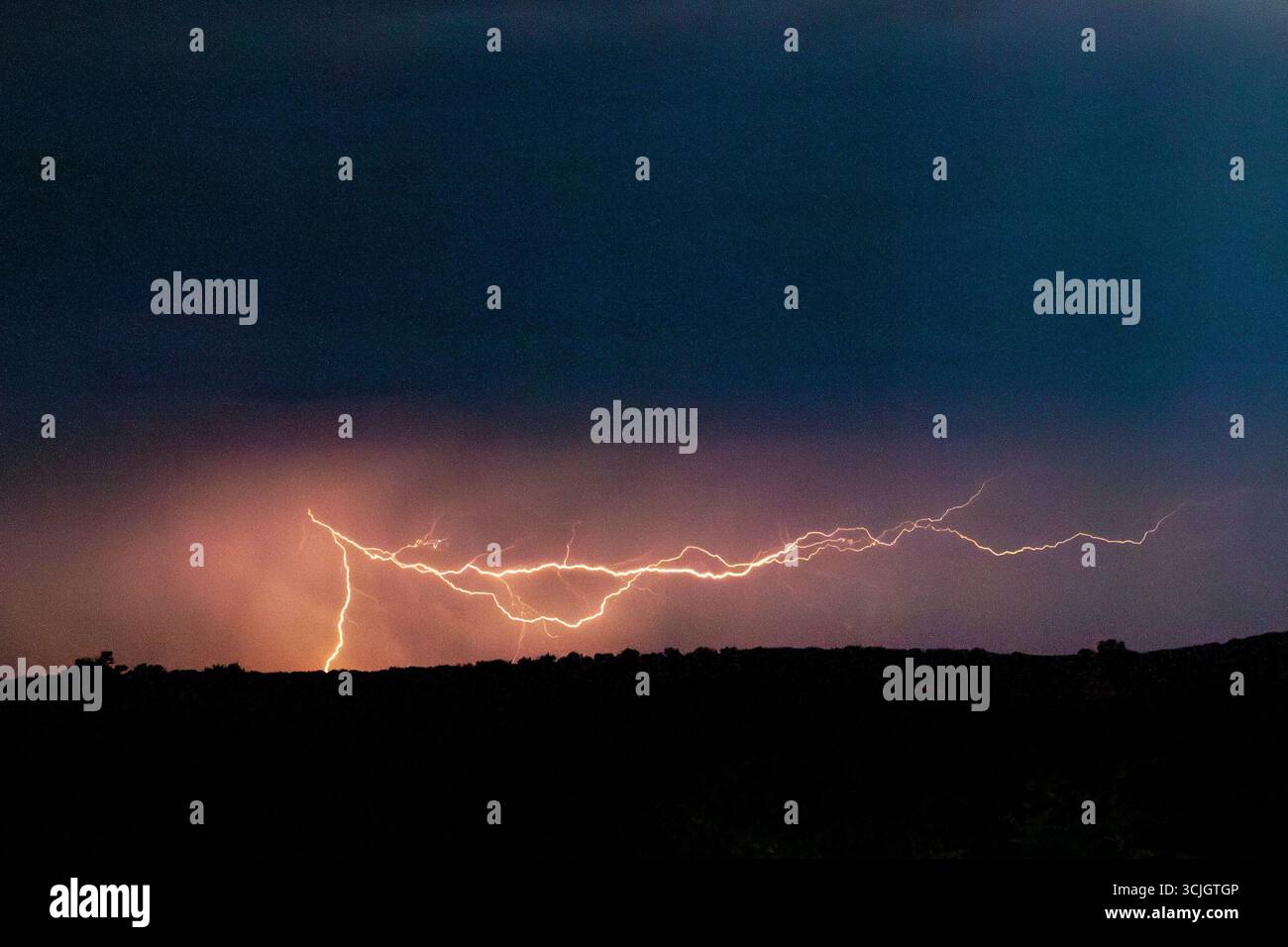 Powerful lighting strikes, thunder and storm in Kgalagadi National Park in South Africa Stock Photo