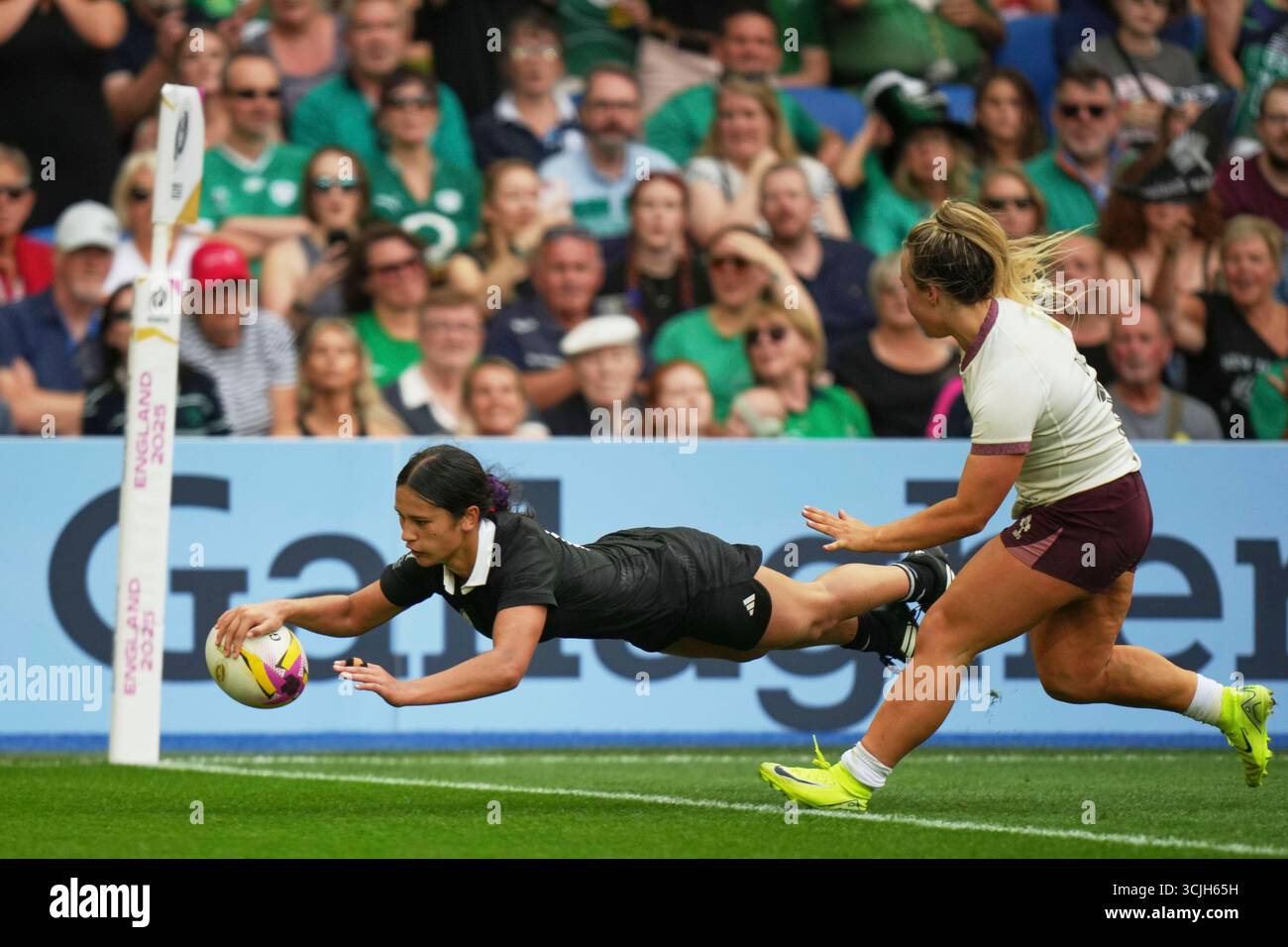 New Zealand's Braxton Sorensen-McGee, left, scores a try as Ireland's ...