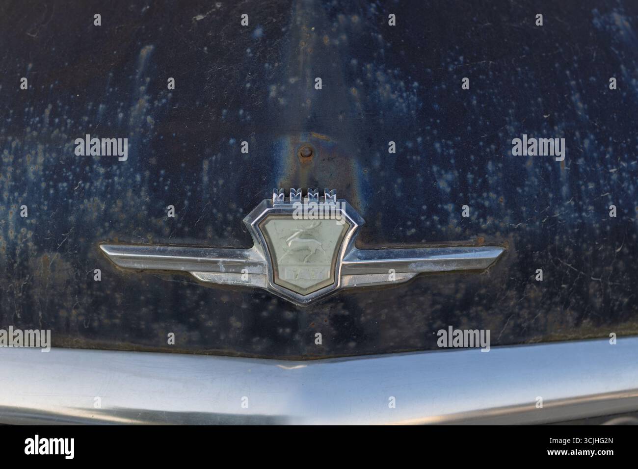 Wroclaw, Poland - August 28 2025: Weathered front badge of vintage Soviet GAZ Volga car Stock Photo