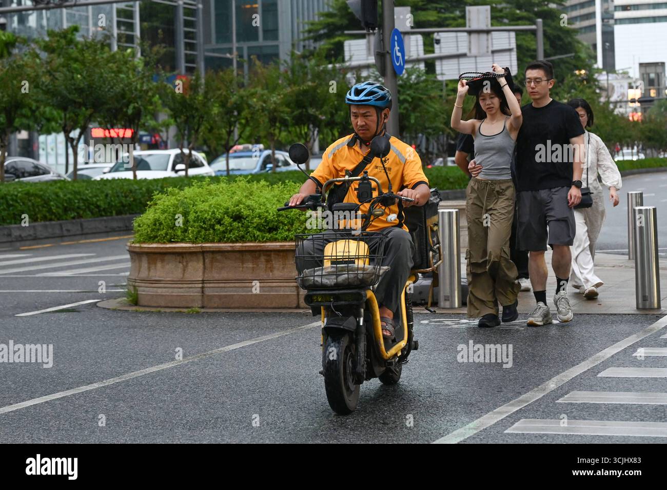 Meituan Riders Shenzhen daily life A general view showing a delivery person of Meituan ...