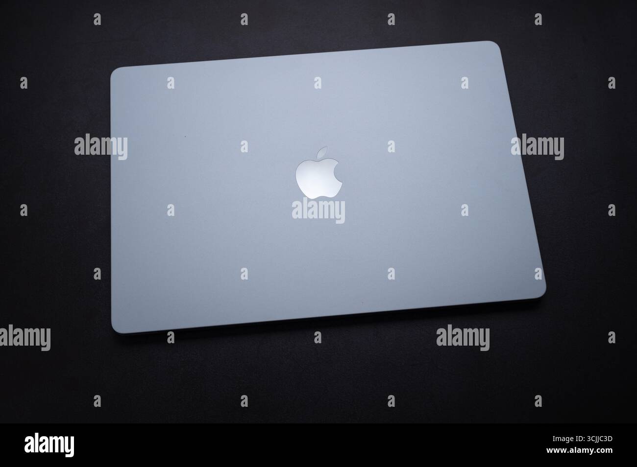 Mainz, Germany - September 07, 2025: MacBook Air with M4 chip resting on a dark surface Stock Photo
