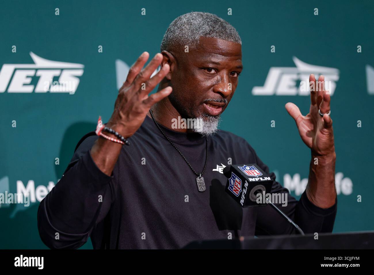 New York Jets head coach Aaron Glenn talks to reporters following an ...