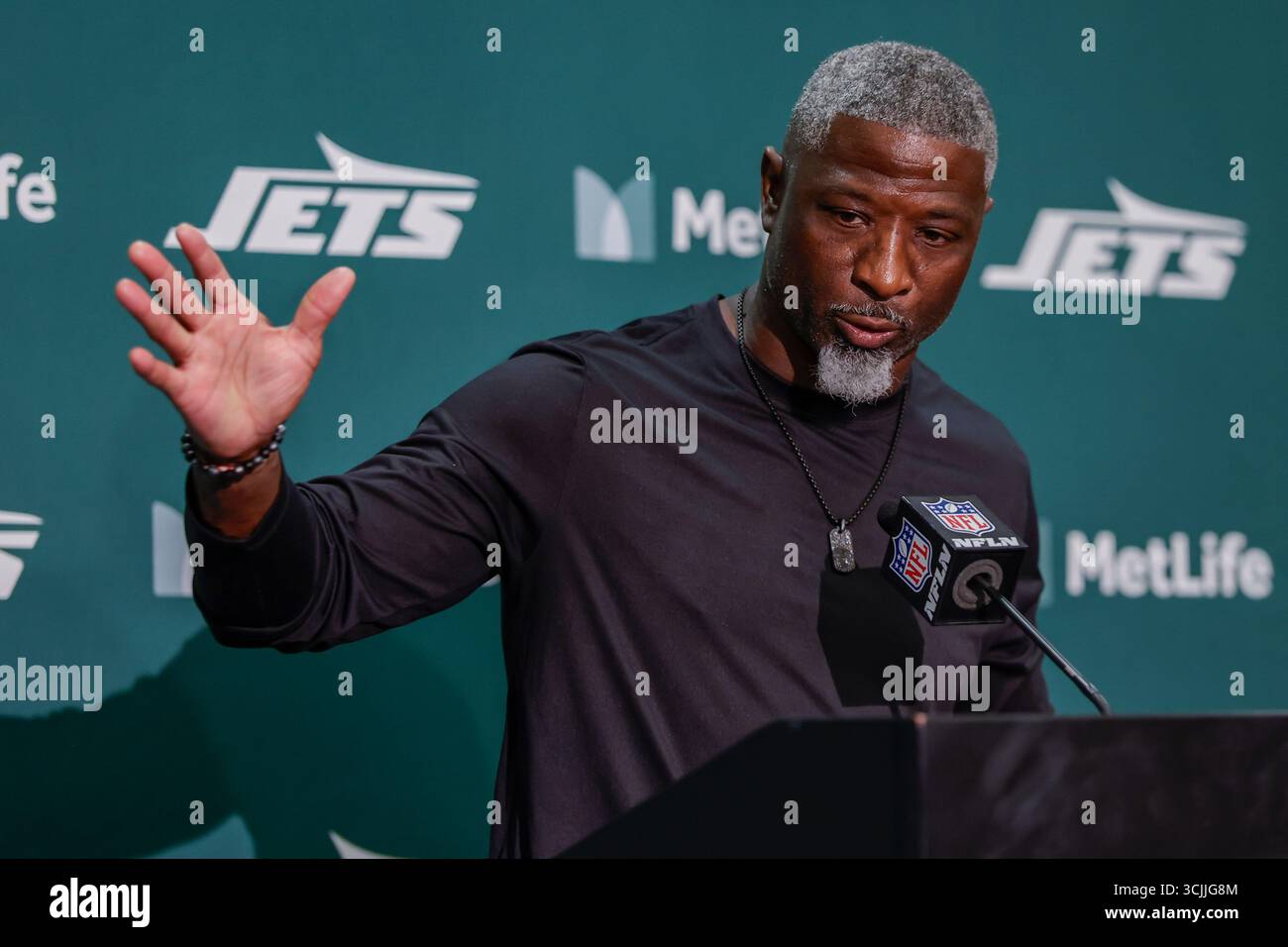 New York Jets head coach Aaron Glenn talks to reporters following an ...