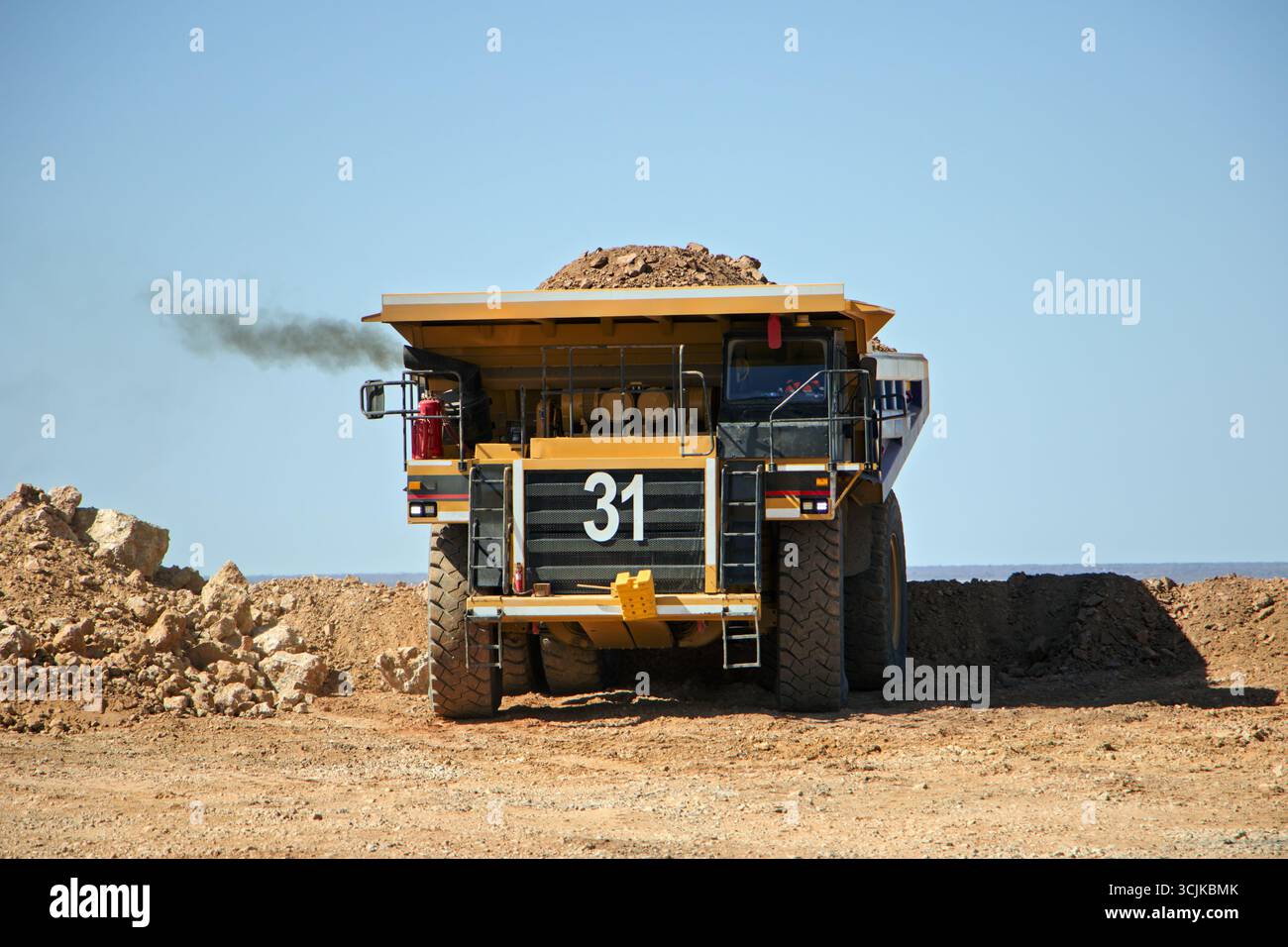 mining truck unloading kimberlite, open pit mine, large industrial operation to extract diamonds, Stock Photo