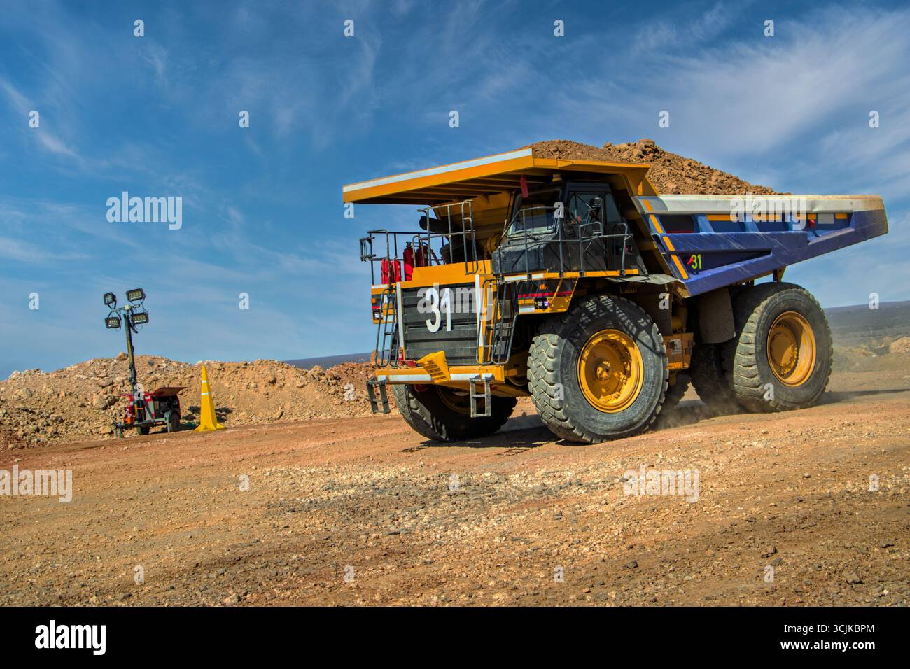 mining truck unloading kimberlite, open pit mine, large industrial operation to extract diamonds, Stock Photo