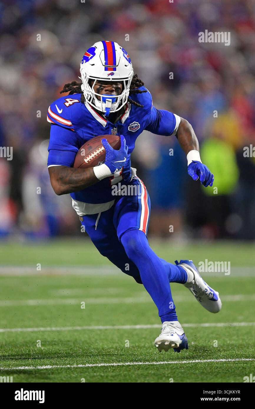 Buffalo Bills running back James Cook (4) runs with the ball during the ...